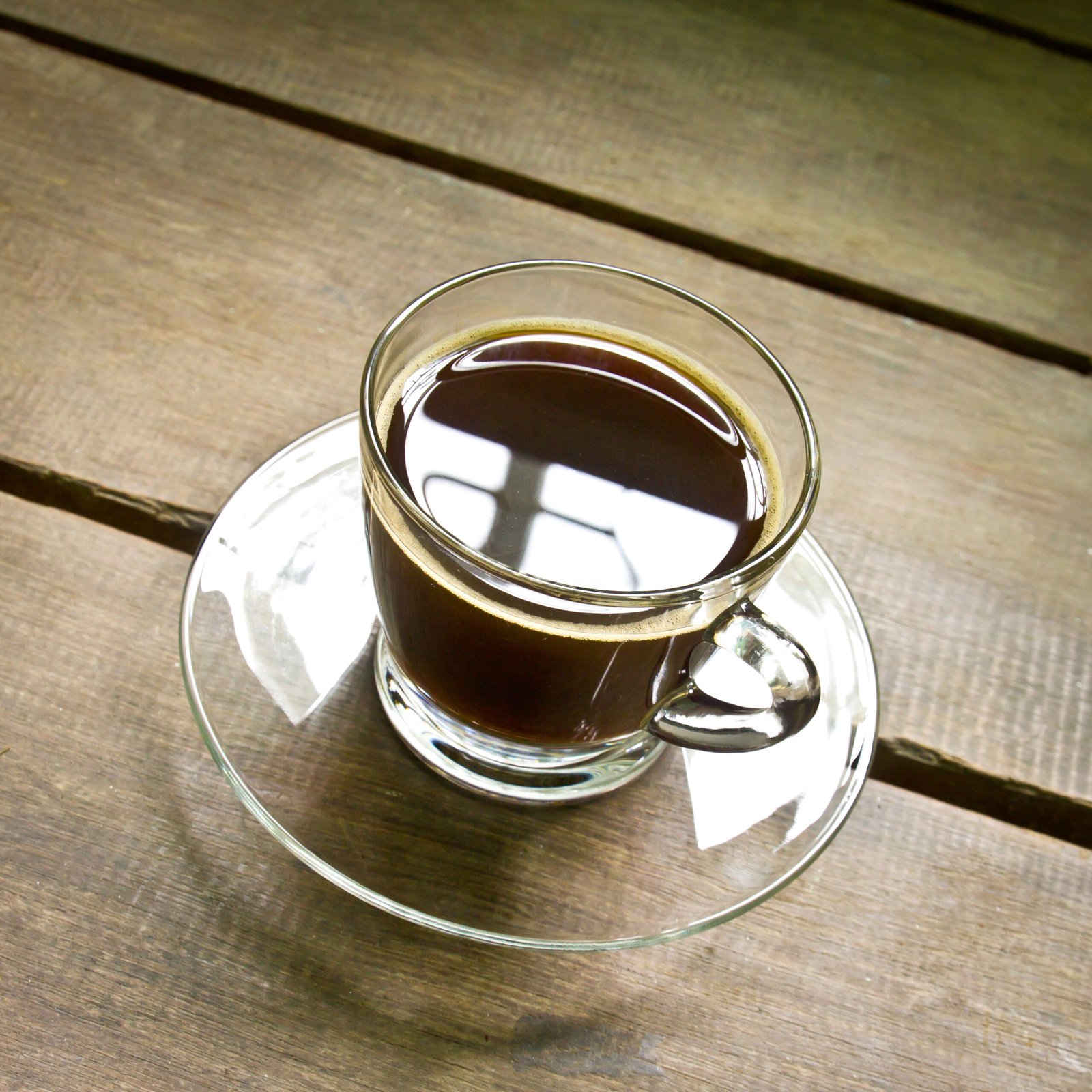 coffee americano in a glass on wood