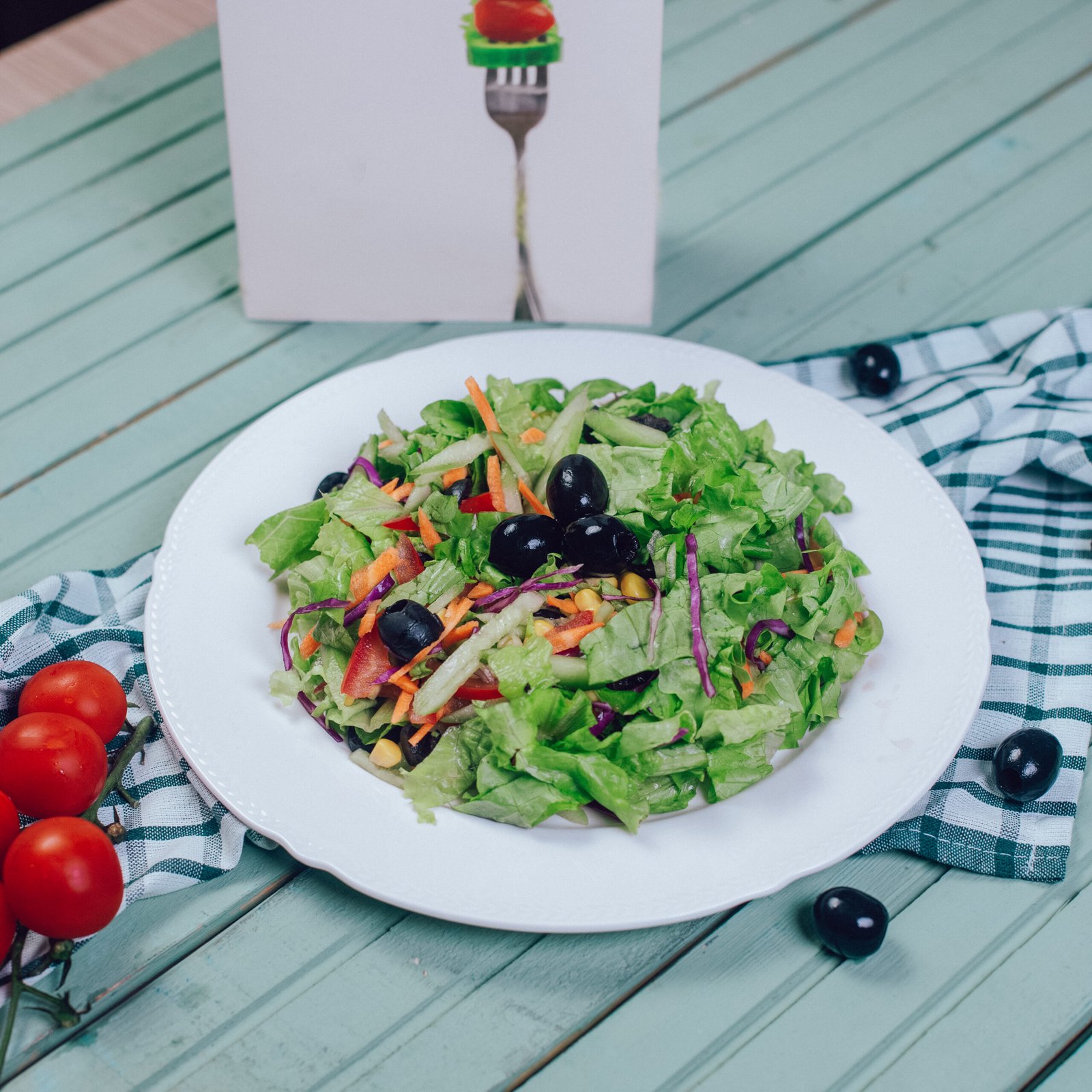 Green salad with chopped lettuce and black olives